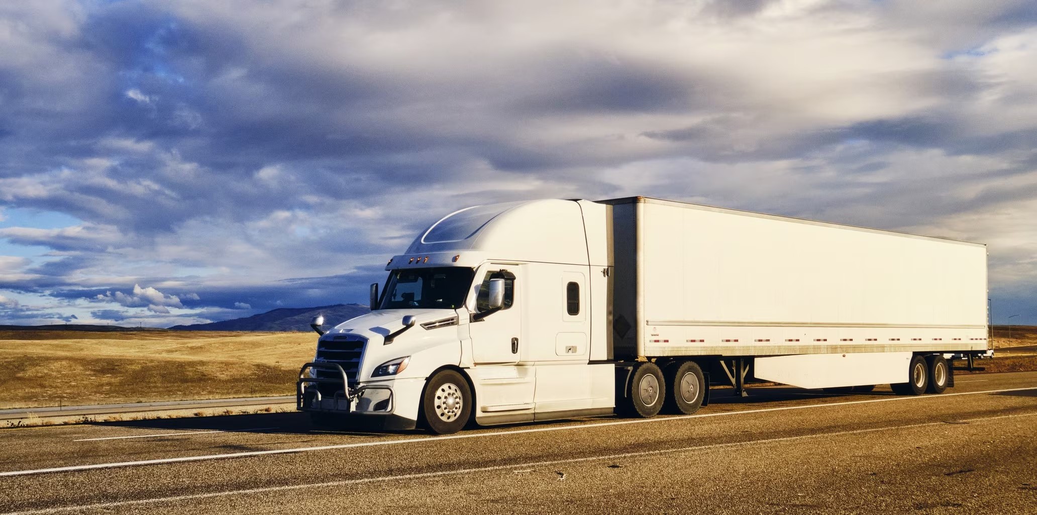 84 EXPRESS LLC tractor-trailer loaded and rolling